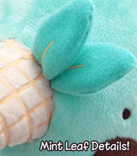 Load image into Gallery viewer, Brown and mint colored narwhal plush with ice cream details and spotted detail on back.
